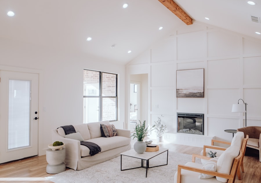 Living room with fireplace, couch, and armchair